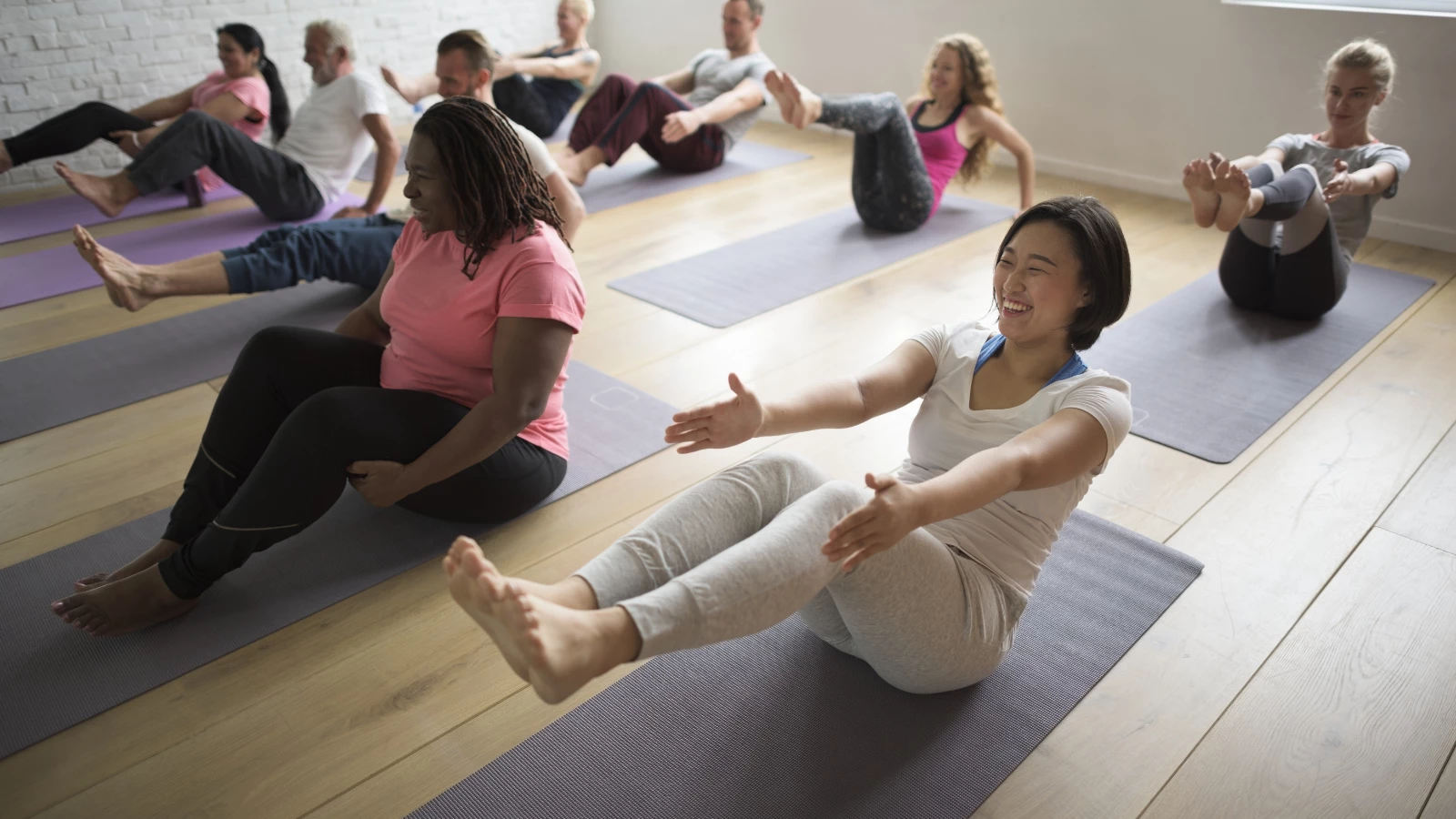 Image depicting a diverse and inclusive yoga class