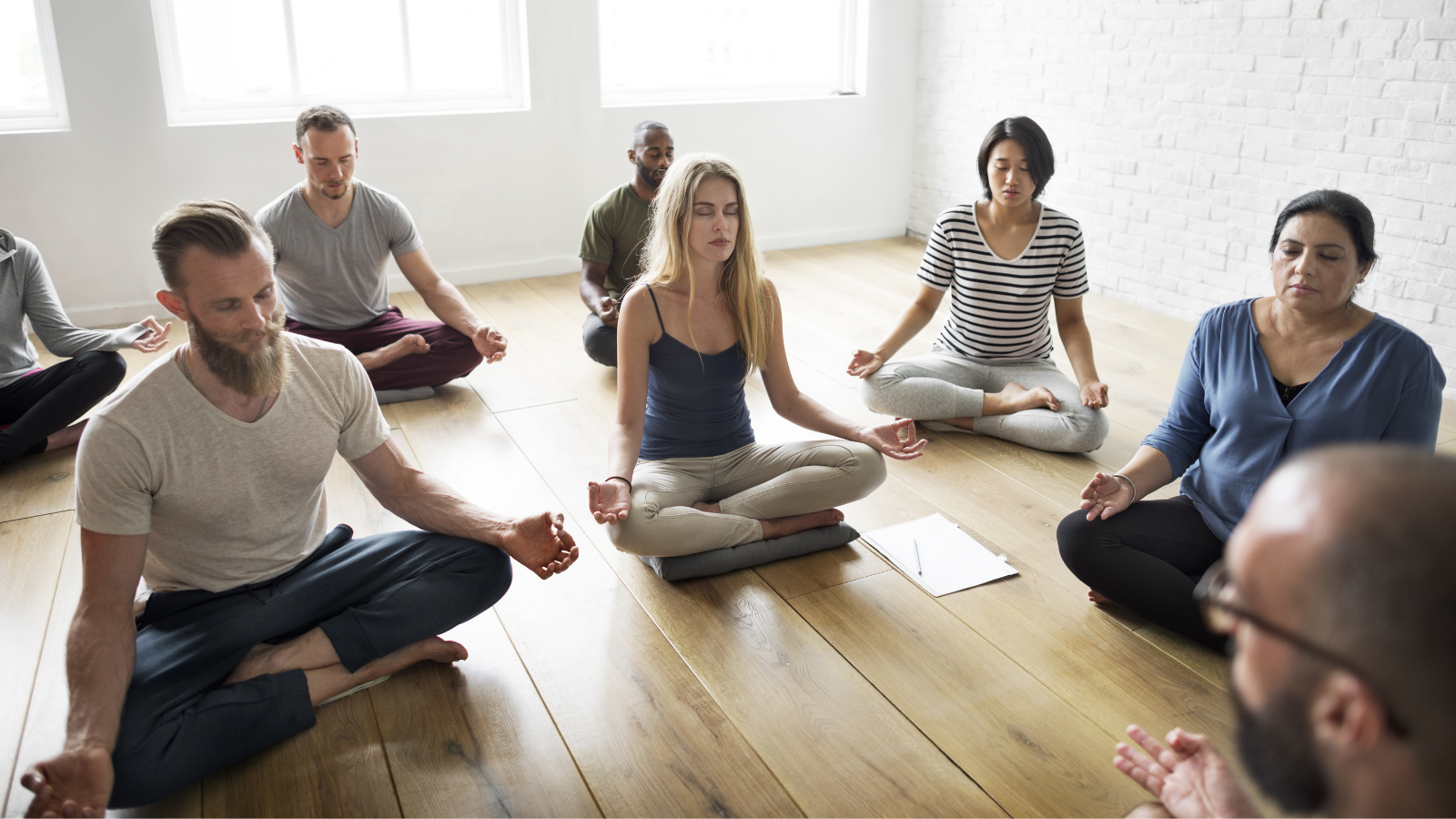 Diverse yoga class supports inclusivity.