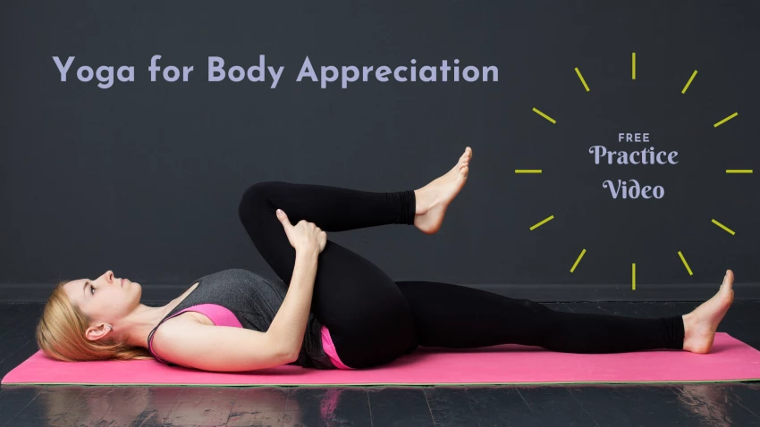 Young woman is doing yoga workout on the mat, stretching legs, gray background