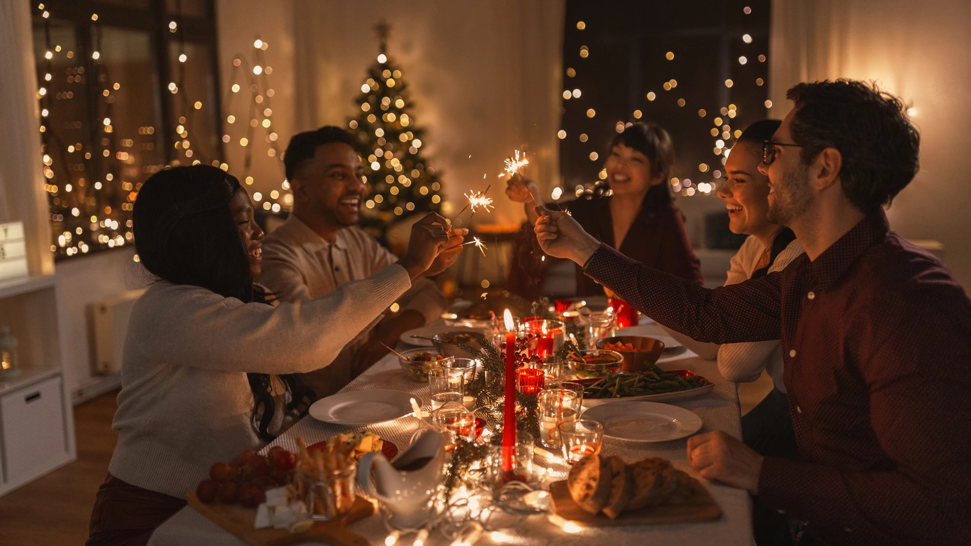 A holiday yoga celebration of a group of happy friends having Christmas dinner together