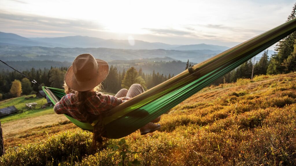 Woman taking a physical workout rest after hiking 