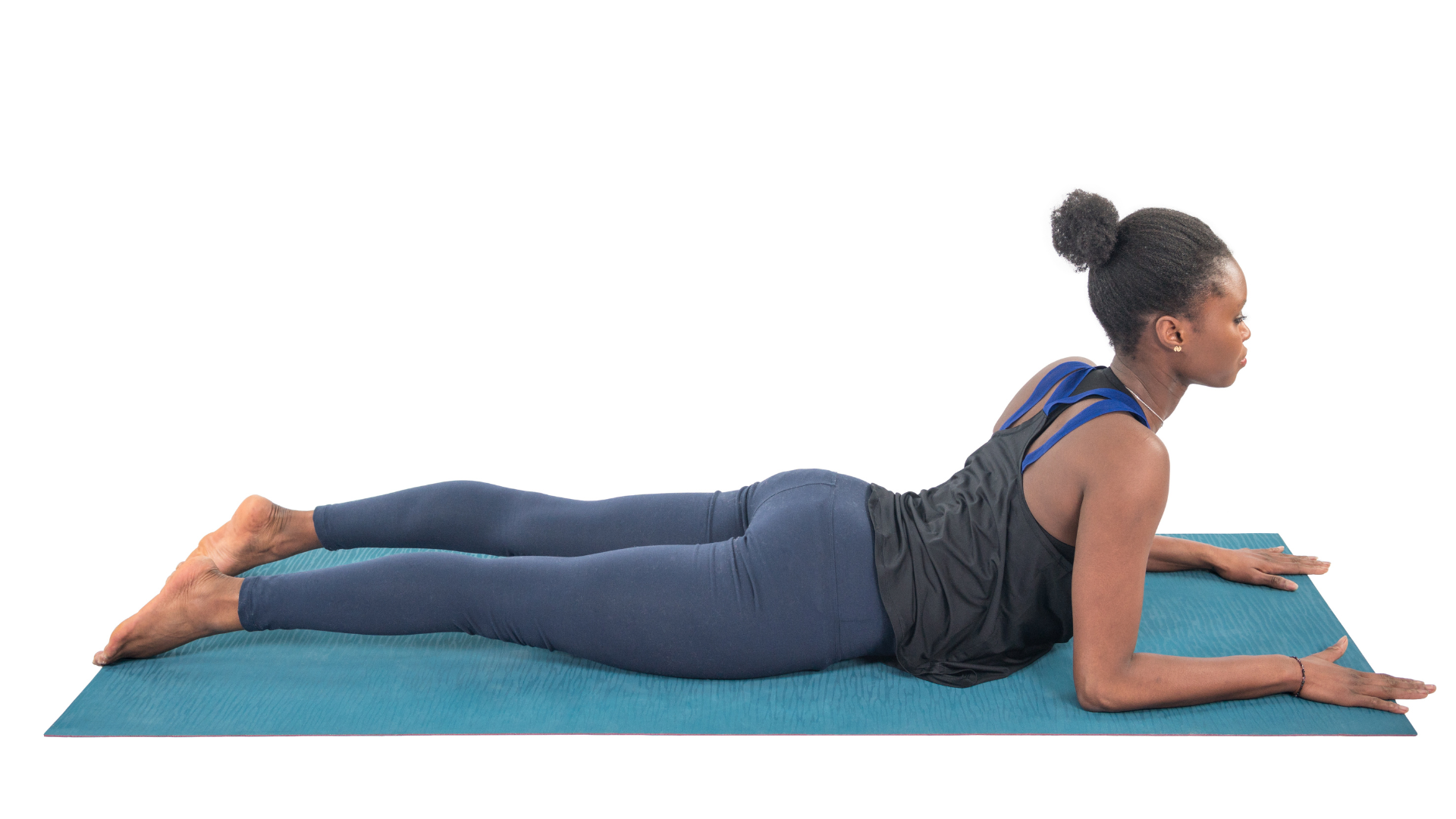 Sphinx Pose is a Backbend and this image represents that backbends can be practiced with care in Yin Yoga.