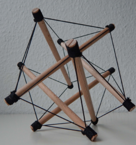 The image depicts a tensegrity structure a well known Anatomy Trains model