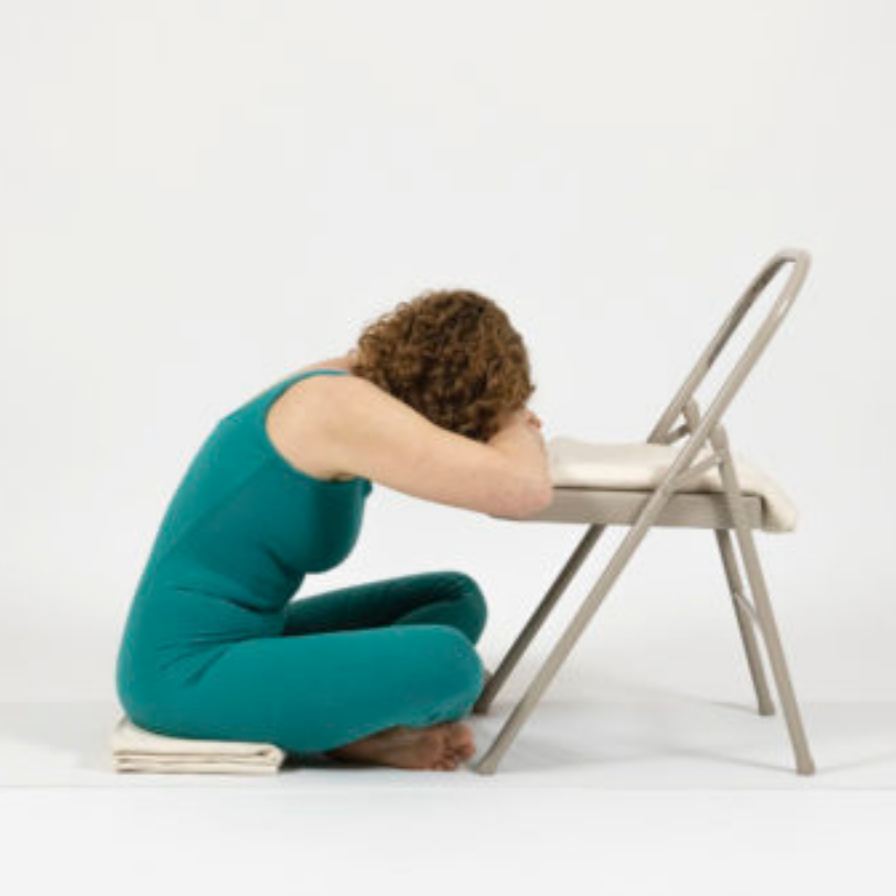 Seated Forward Bend Cross Legged or Sukasana version with the support of a chair.