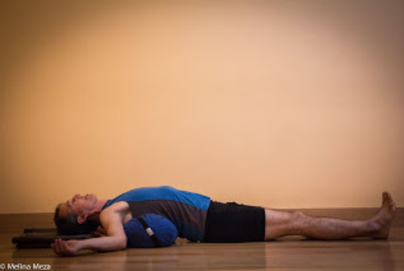 Passive Restorative Backbend with a Bolster for Support