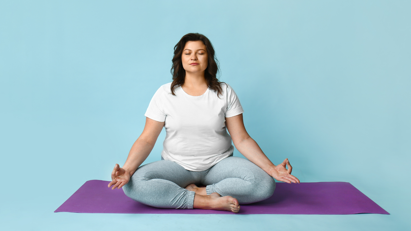 Beautiful woman meditating on color background and practicing gratitude