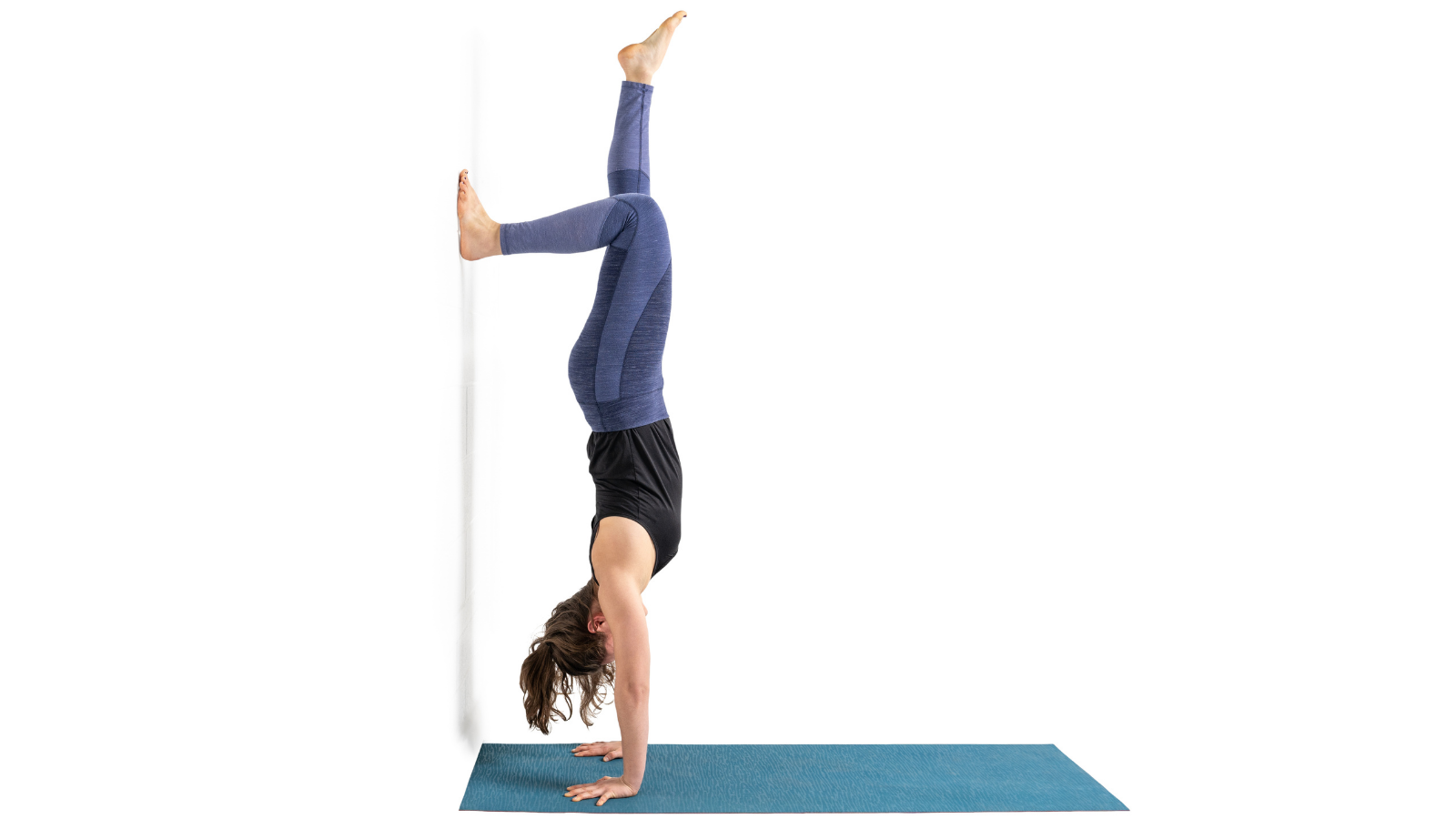 The inversion Handstand or Adho Mukha Vrksasana practiced at the wall.