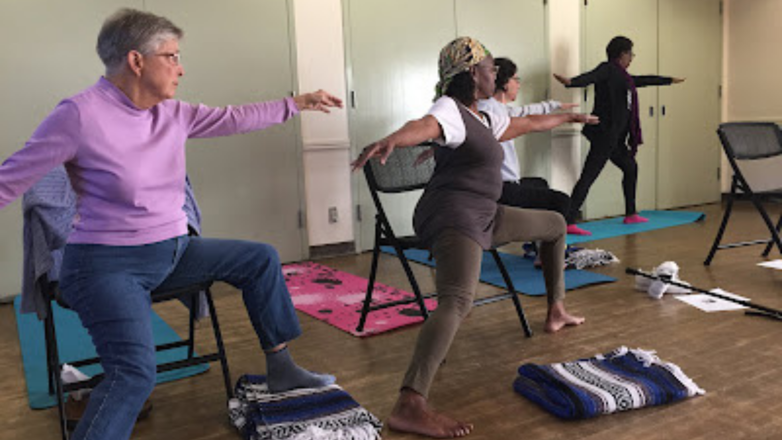 Yoga students working with props and breath practices