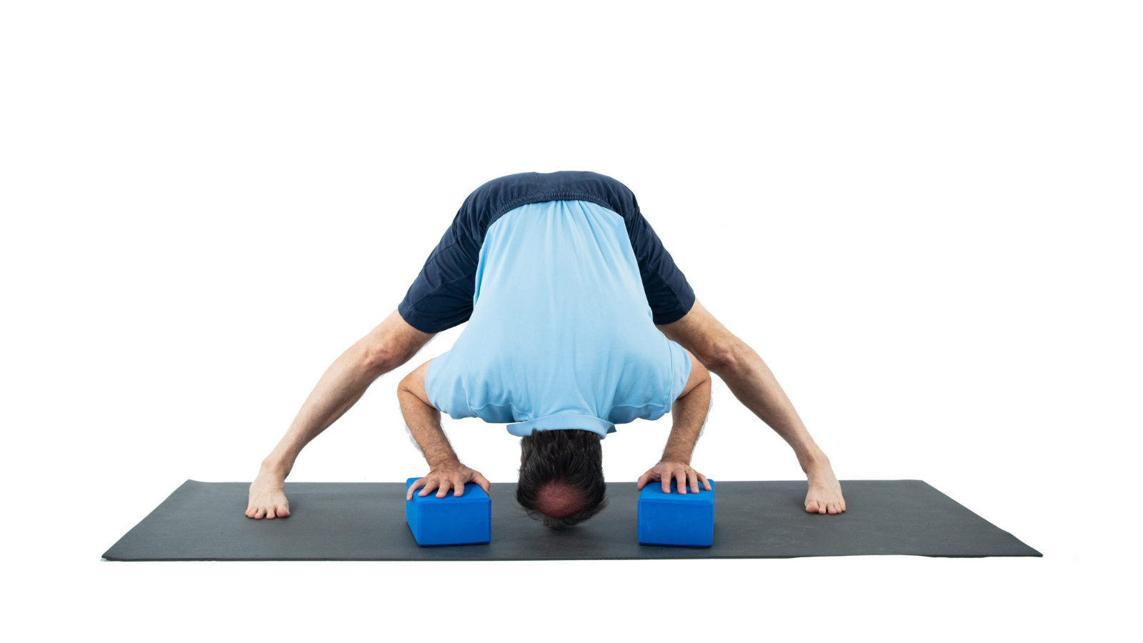 Yoga Pose: Revolved Wide Legged Forward Bend