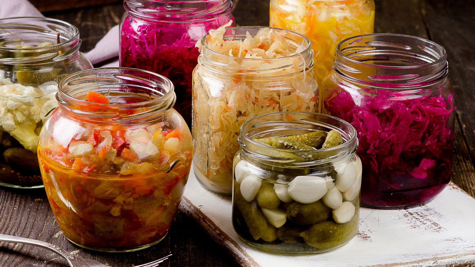 Fermented vegetables or fermented foods in jars for gut health and boost immunity. Vegetarian, healthy food concept.