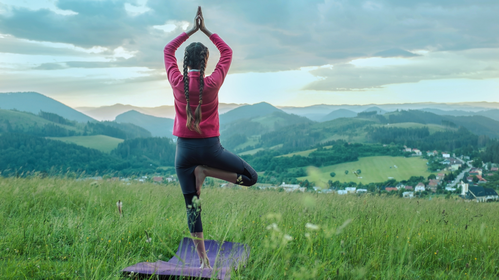 Girl doing yoga in nature, fresh air in park.