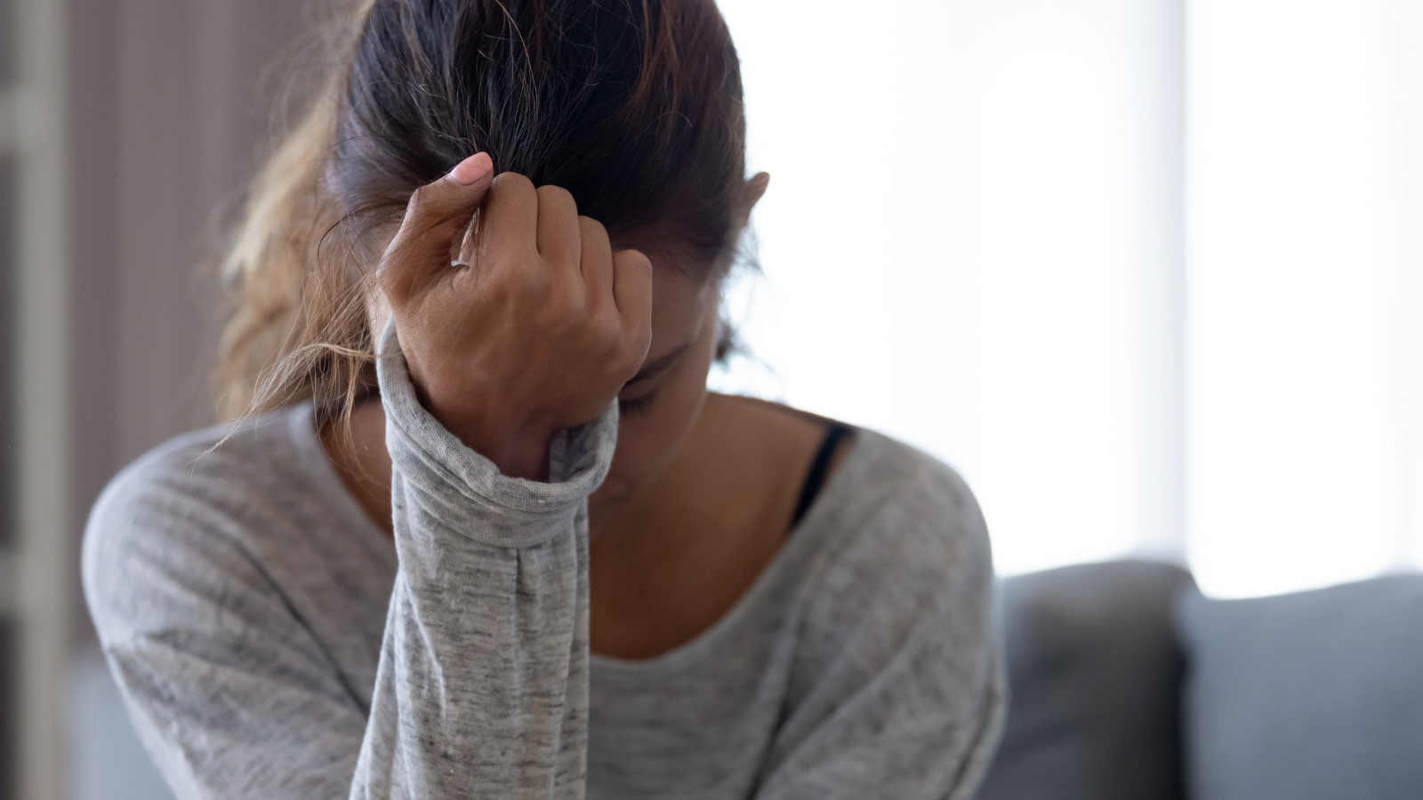 Depressed upset young woman feeling hurt, sad, stressed, troubled.