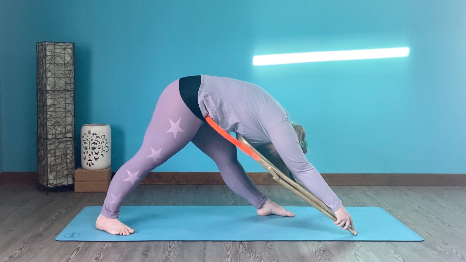 Parsvottanasana an asymmetrical forward fold using a chair.