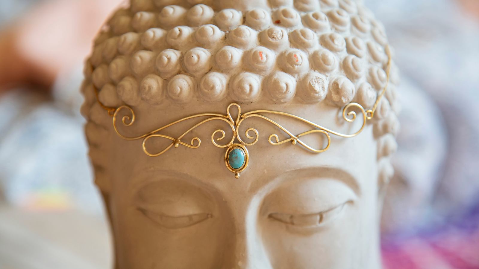 Brass tiara with gemstone on Buddha statue head