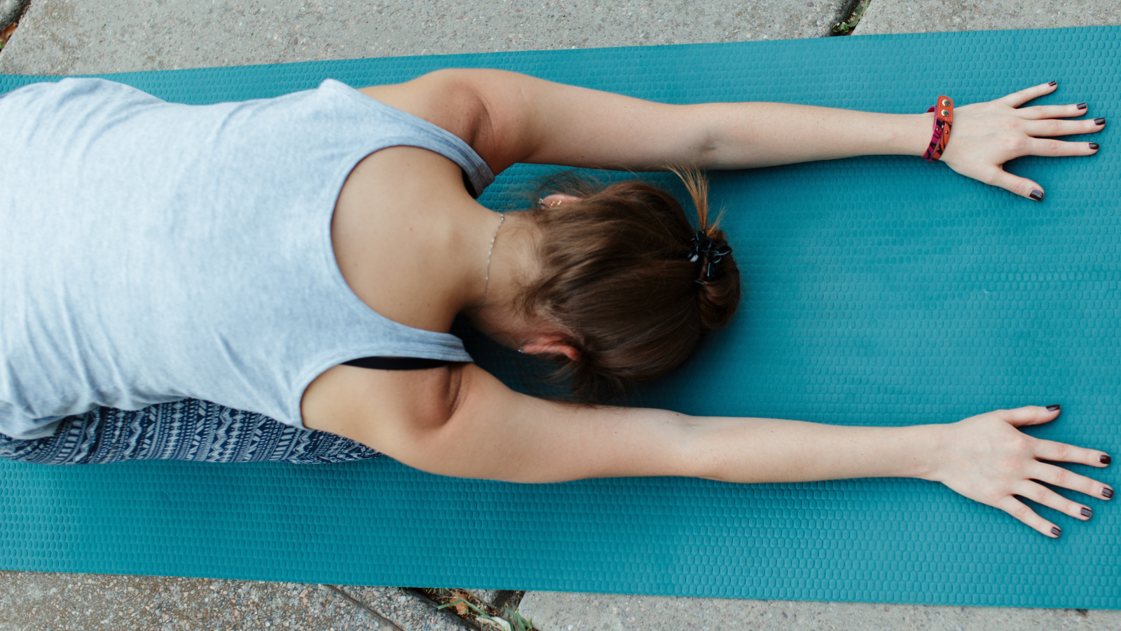 Image of yoga student practicing Child's Pose, or Balasana, a gentle and calming asana