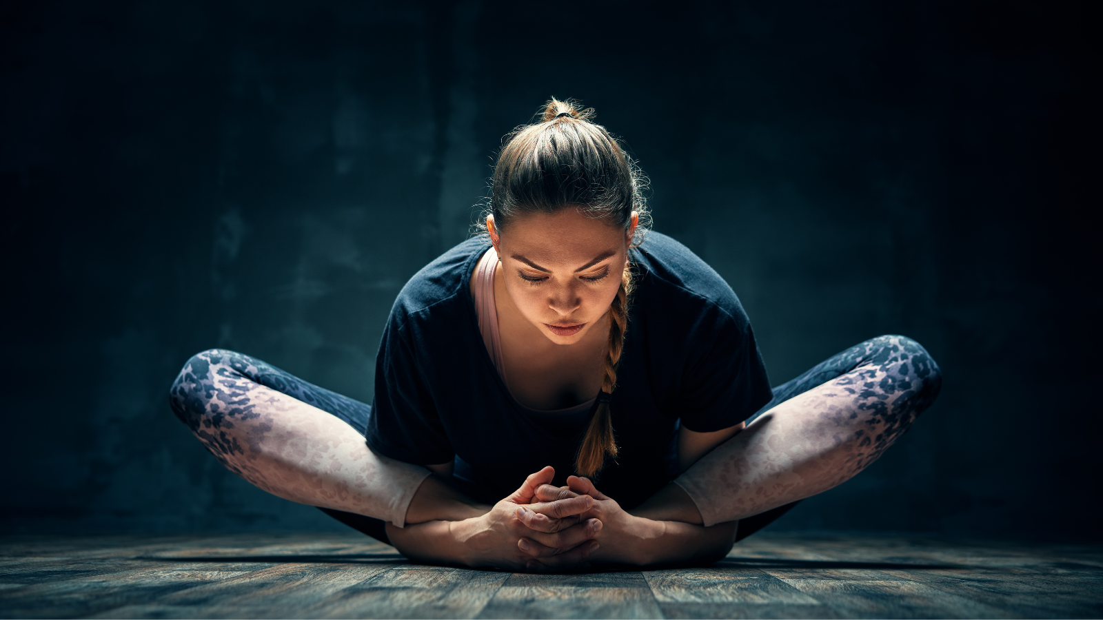 Young woman practicing yoga's Baddha Konasana Pose. 