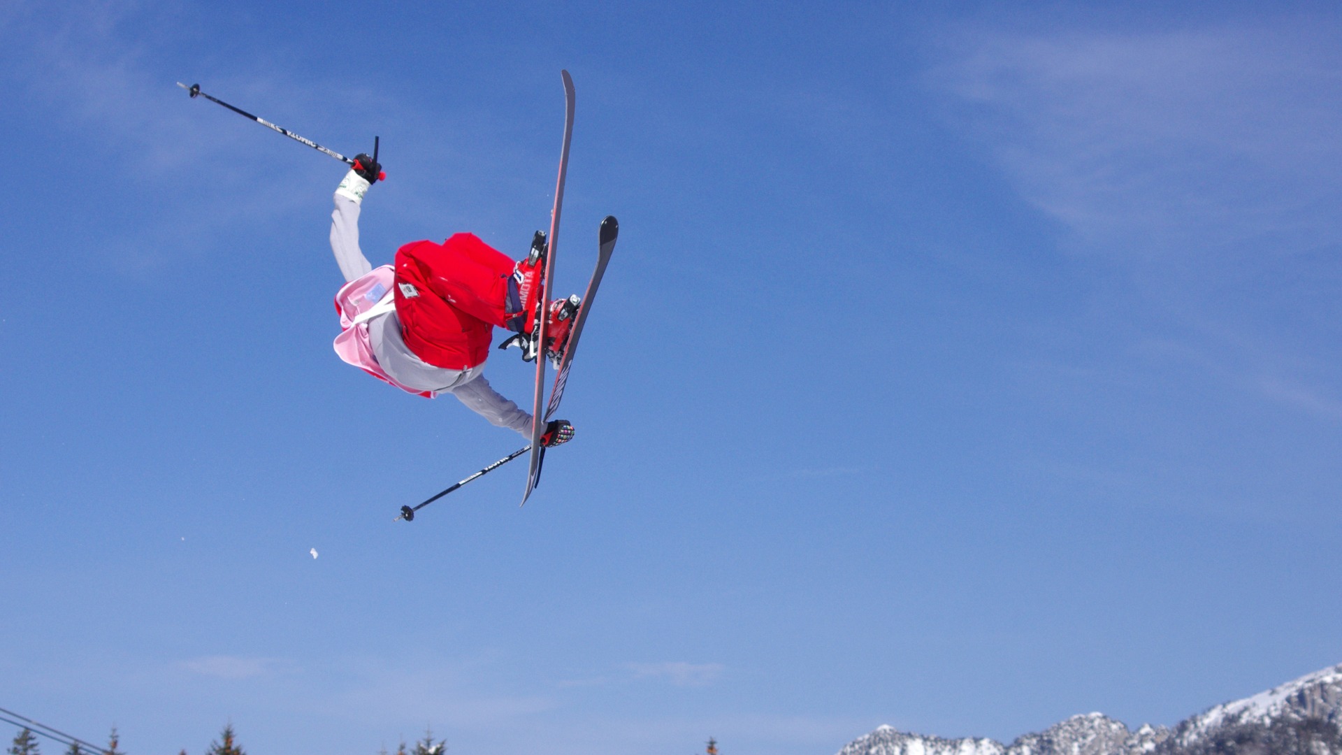 Athlete executing a ski jump with somersaults, an excellent example of heightened proprioception.