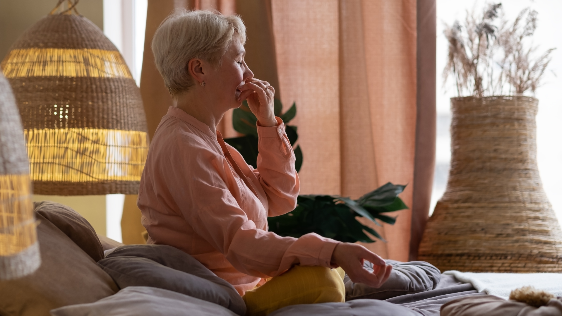 Senior woman practicing yoga's Respiratory practice-Alternate Nostril Breathing also known as Nadi Shodhana Pranayama Pose.