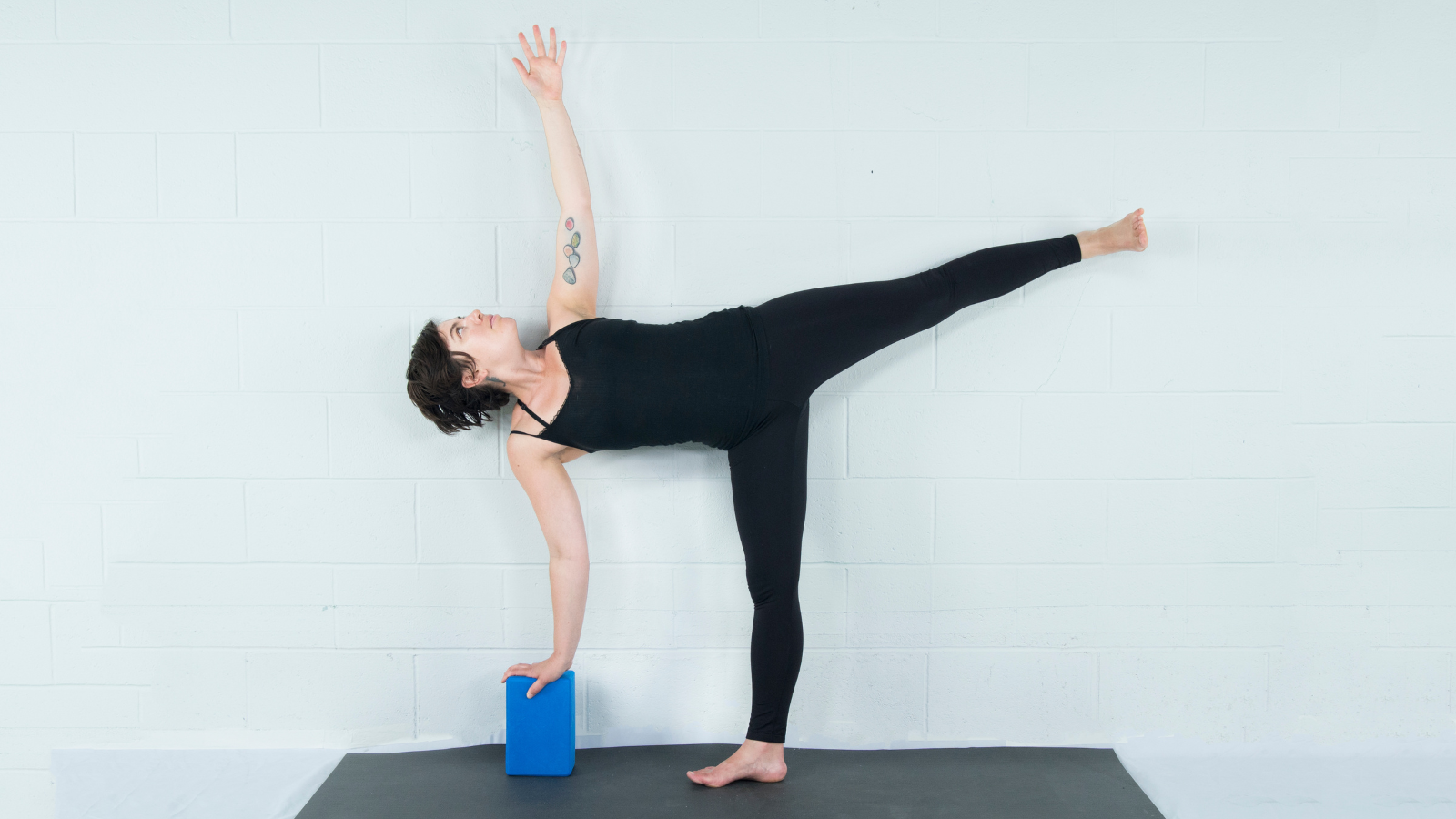 Female yogi standing on one leg. Yoga asana Warrior 3 Pose