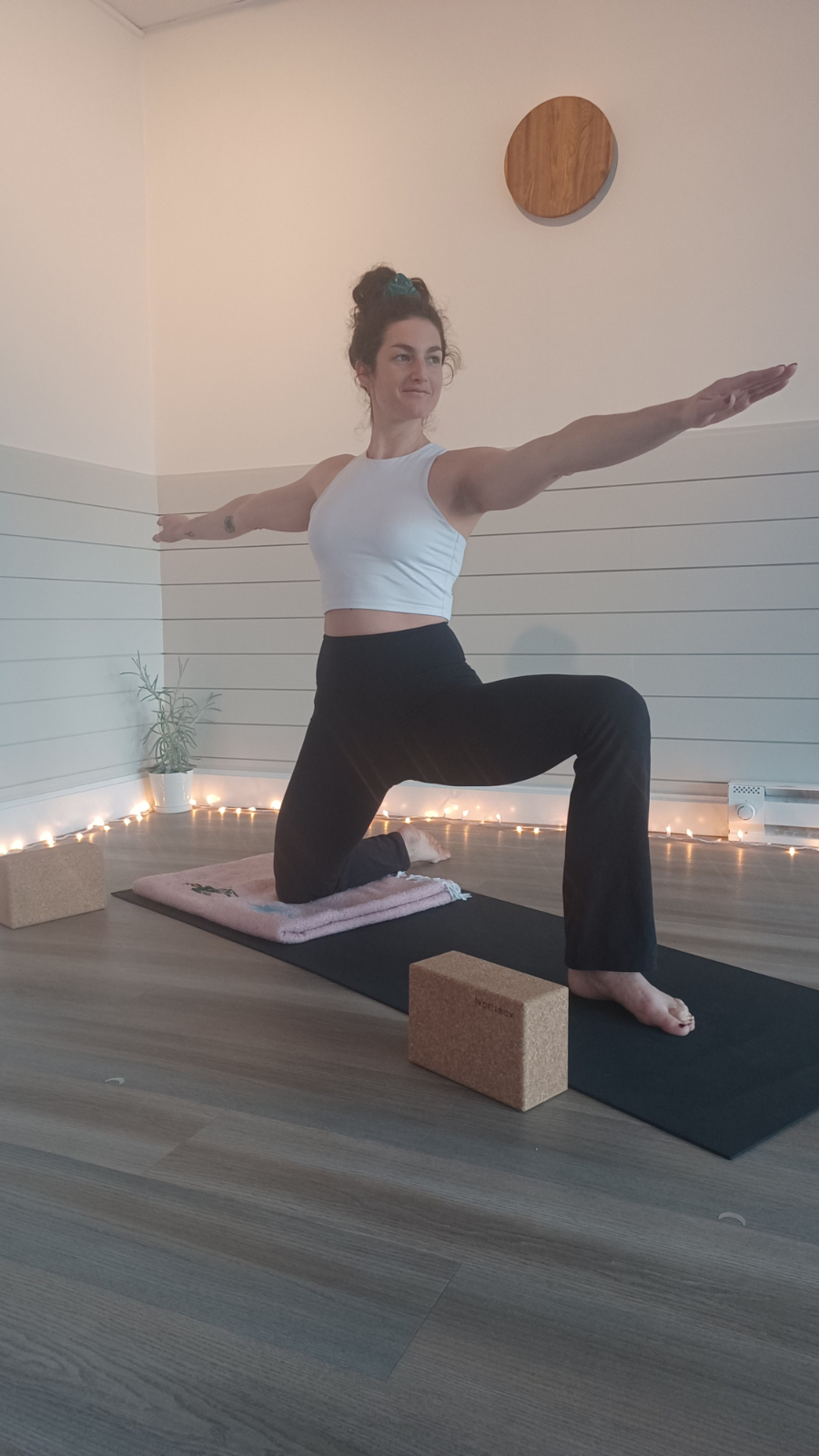 An accessible and kneeling version of Warrior ll Pose or accessible yoga pose variation of Virabhadrasana ll Pose.