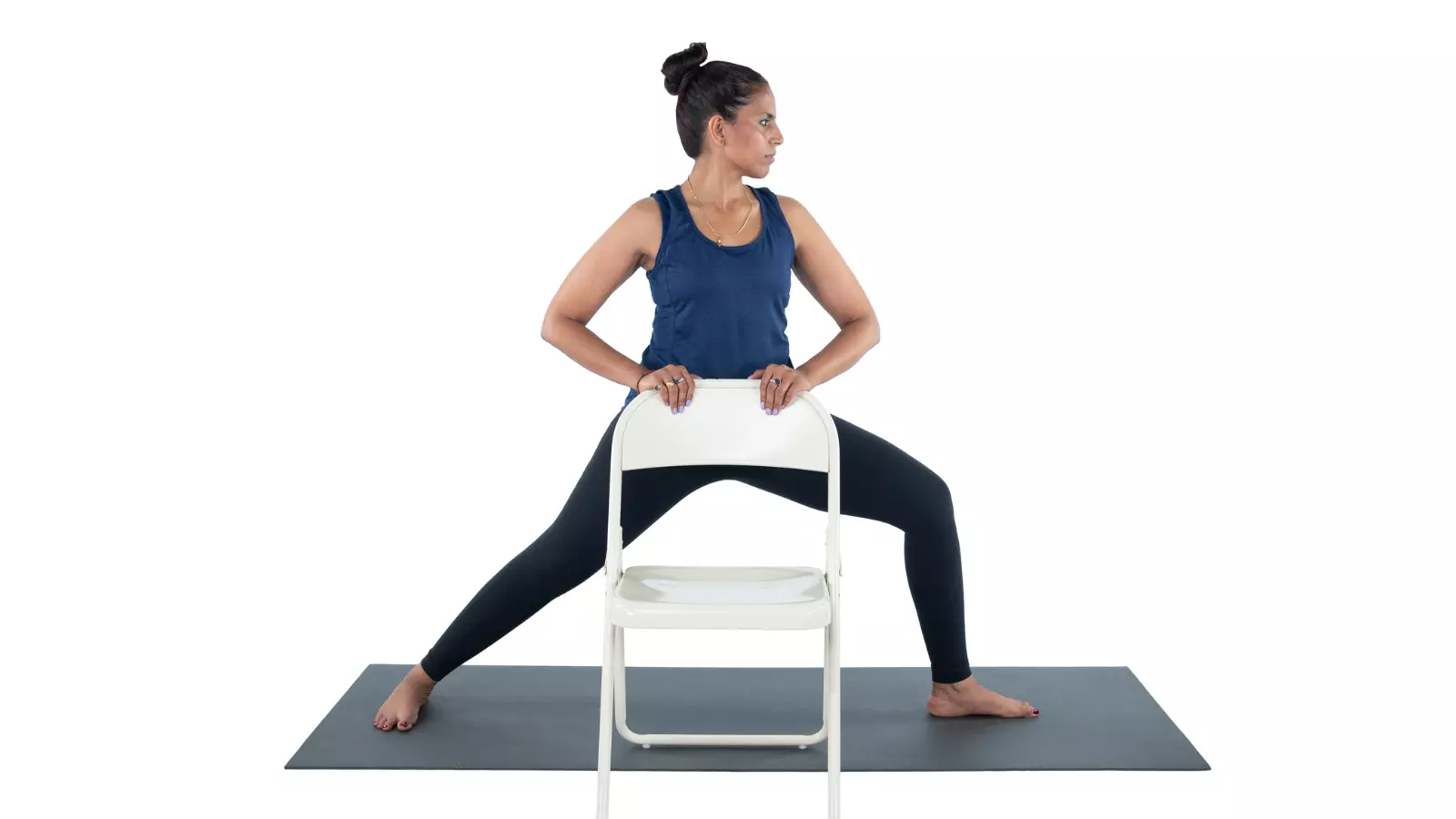  Using a chair to help with Warrior ll Pose alignment and learning the pose.