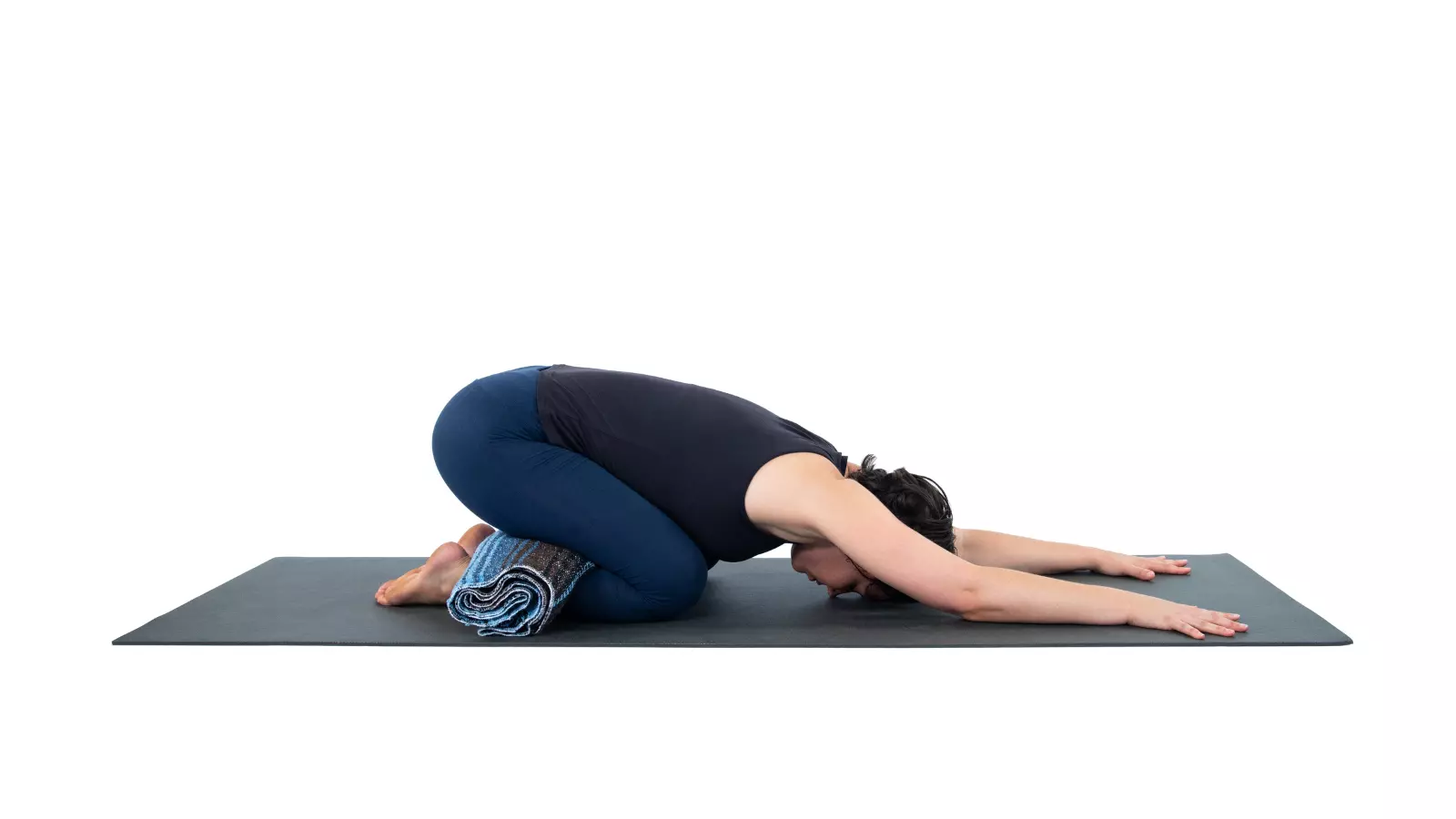 Performing the bow pose. A yoga class lying on their stomachs and pulling  their legs over their backs Stock Photo - Alamy