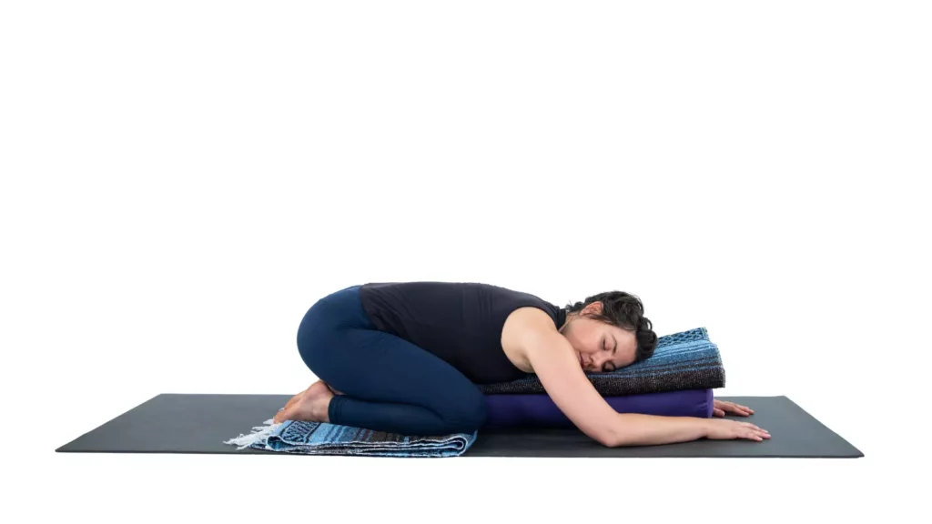 Restorative Yoga (Supported Child's Pose or Supported Balasana), poses with props, Child's Pose with props, Restorative Forward Bend.