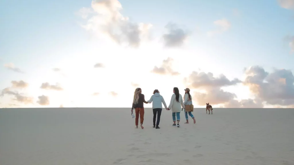 Family of four filipino women walking and hugging each other. Beautiful women of different generations spending time together. Concept of intergenerational trauma.