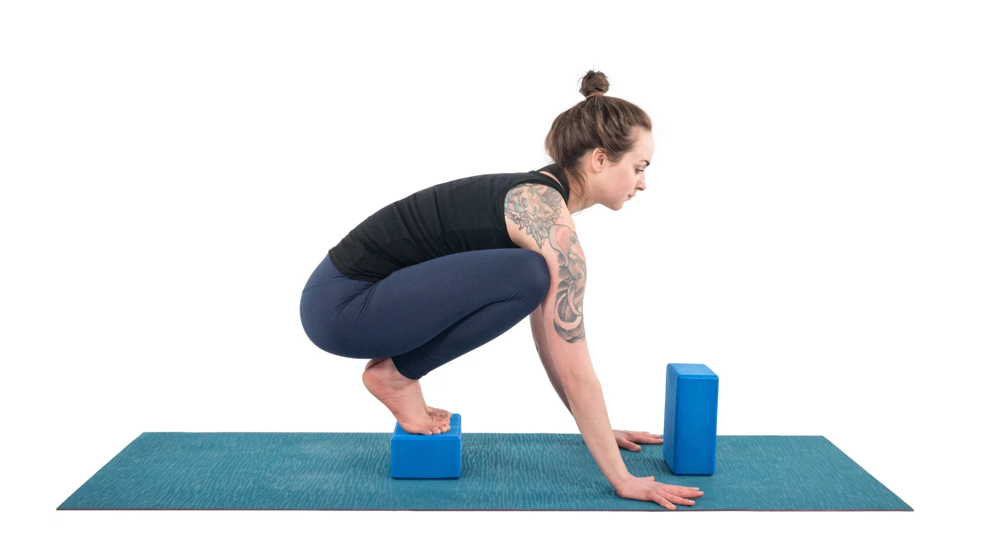 Getting started in Crow Pose? Use props to get started on your Crow Pose journey.