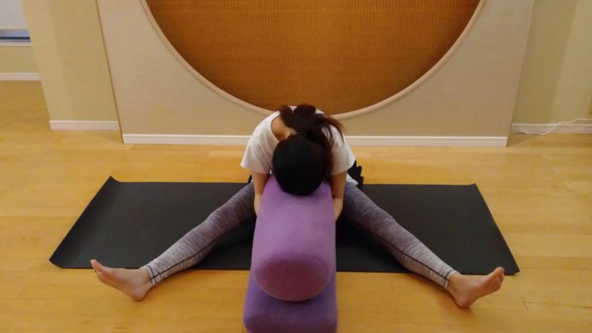 A Young Woman Practicing The Spread Leg Forward Fold Yoga Pose High-Res  Stock Photo - Getty Images