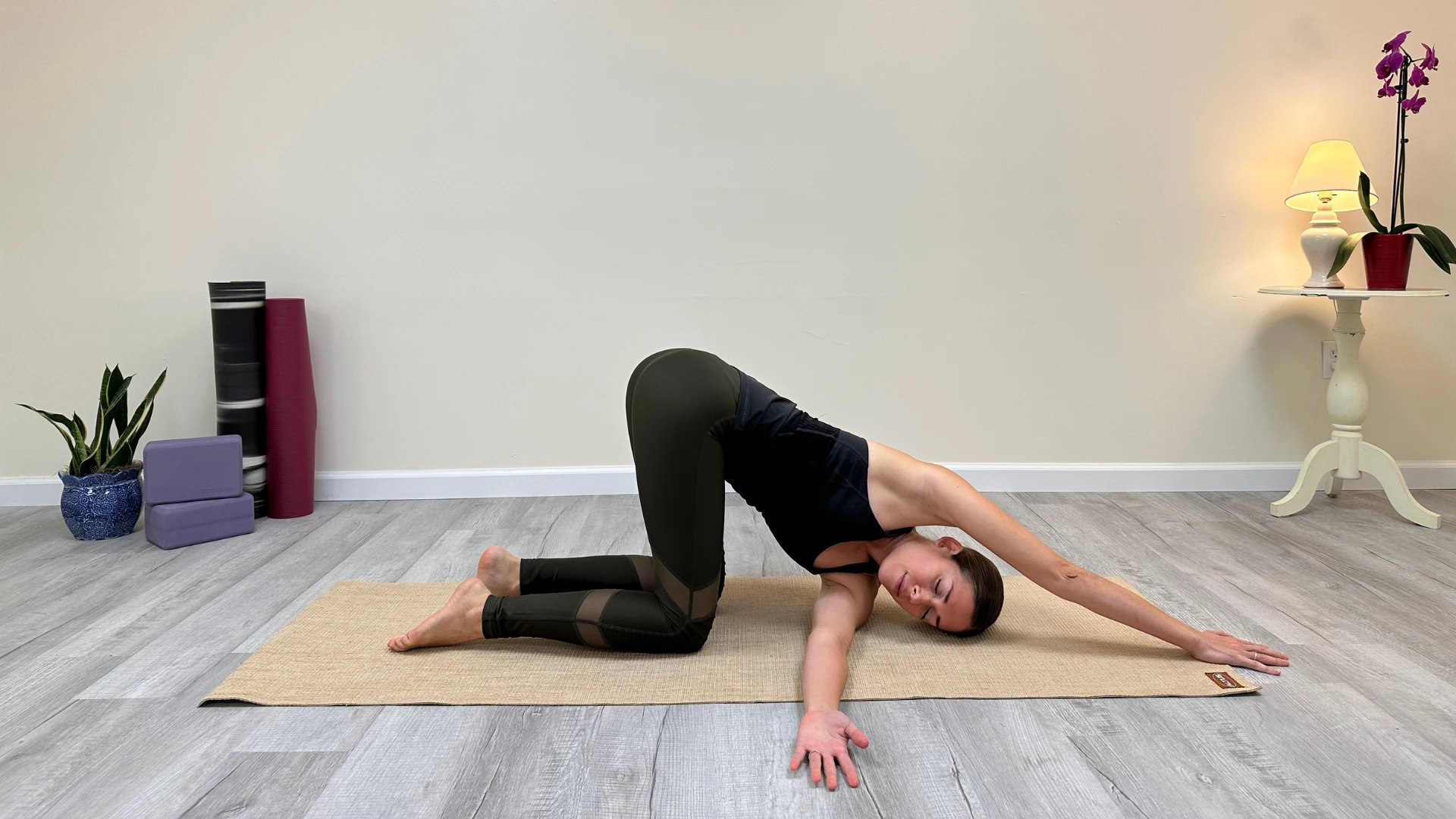 Thread the Needle Pose is a yoga warm up pose that helps increase lymphatic drainage.