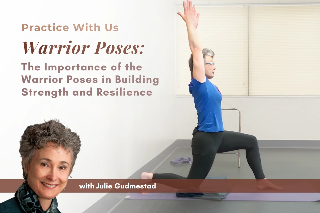 Julie Gudmestad demonstrating Warrior One at a wall with arms lifted overhead in proper alignment