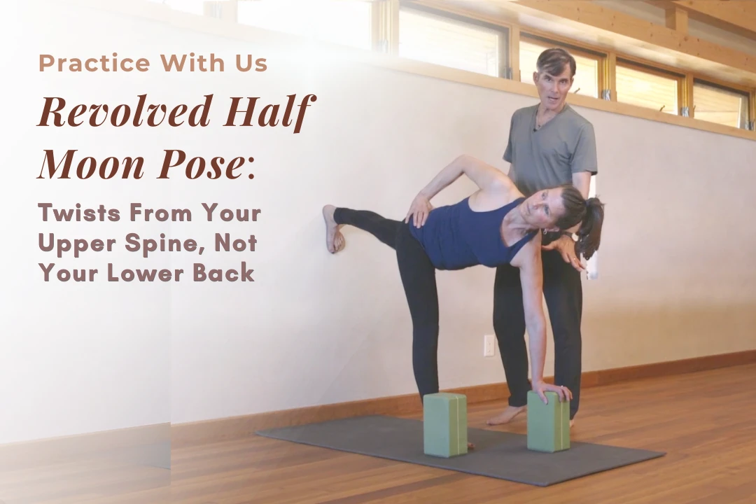 Tias Little demonstrating Revolved Half Moon Pose (Parivrtta Ardha Chandrasana) with a block under the bottom hand and torso rotating open at a wall.